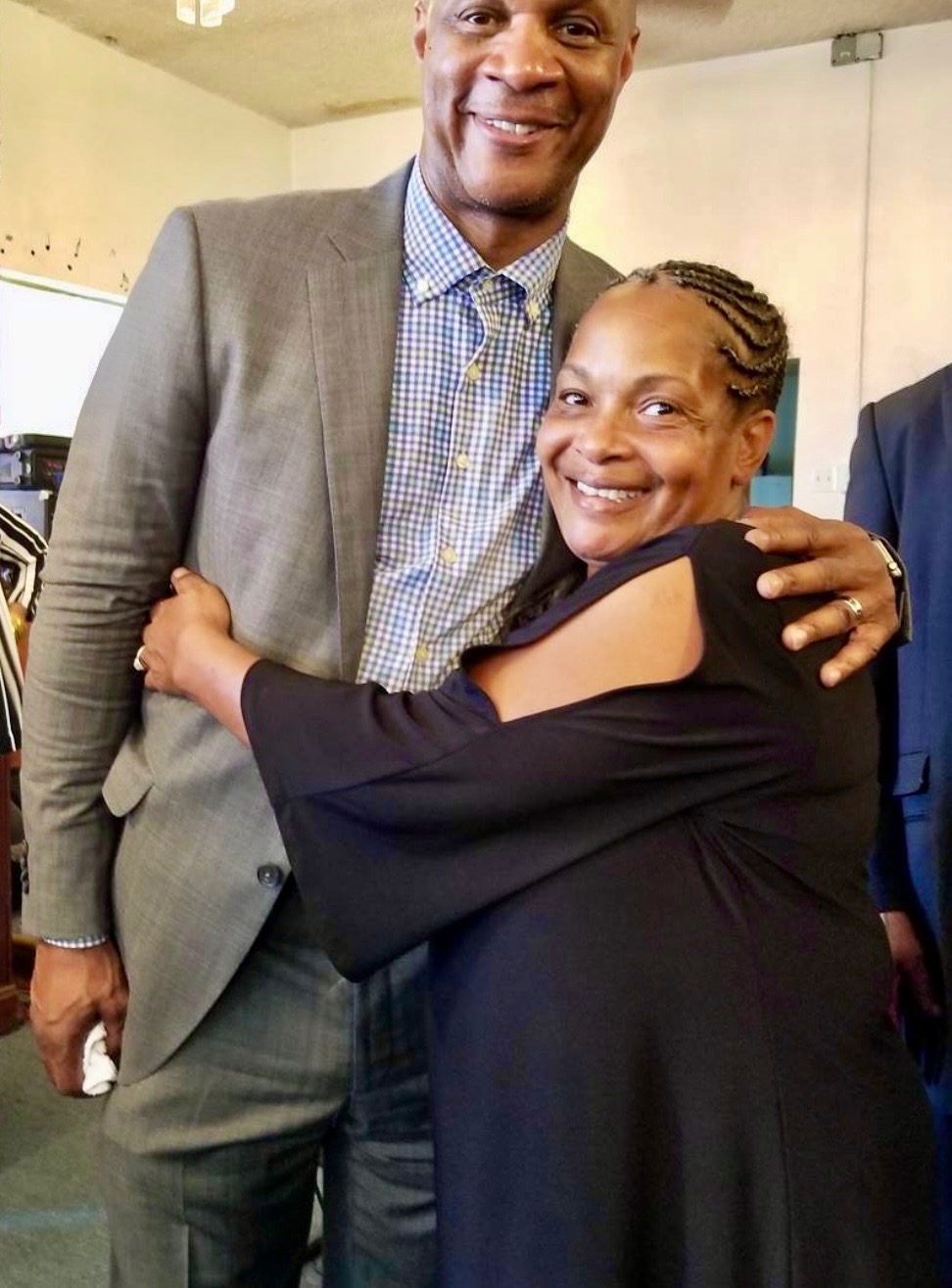 Darlene Young hugging MLB legend Darryl Strawberry